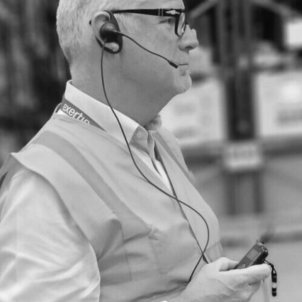 person wearing tourguide earpiece